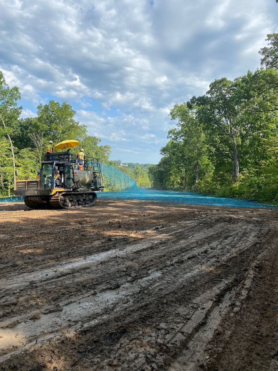 Hydroseeding crew applying seed and mulch on a restored right-of-way