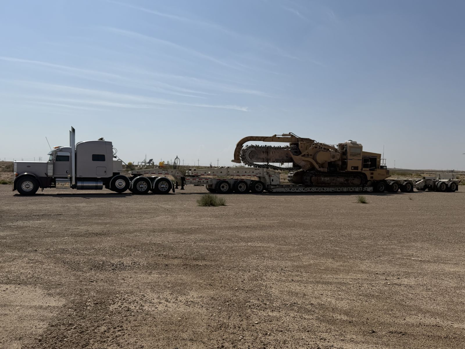 Trencor trencher loaded on a lowboy trailer